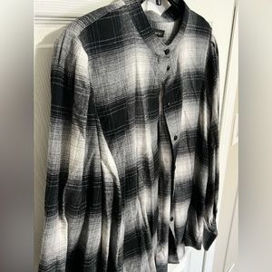 The sleeves on this button down are large. Size XL. Grey, white & black in color